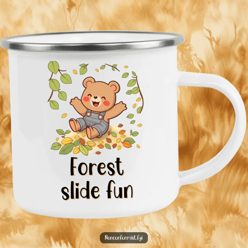 Funny camping mug showing a playful bear in overalls sliding down a hill of autumn leaves, ready for adventure.