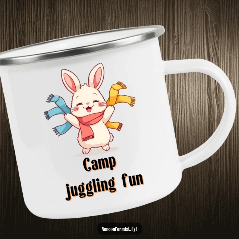 Funny camping mug featuring a fluffy rabbit character joyfully juggling colorful scarves, ready for outdoor fun and vibrant moments.