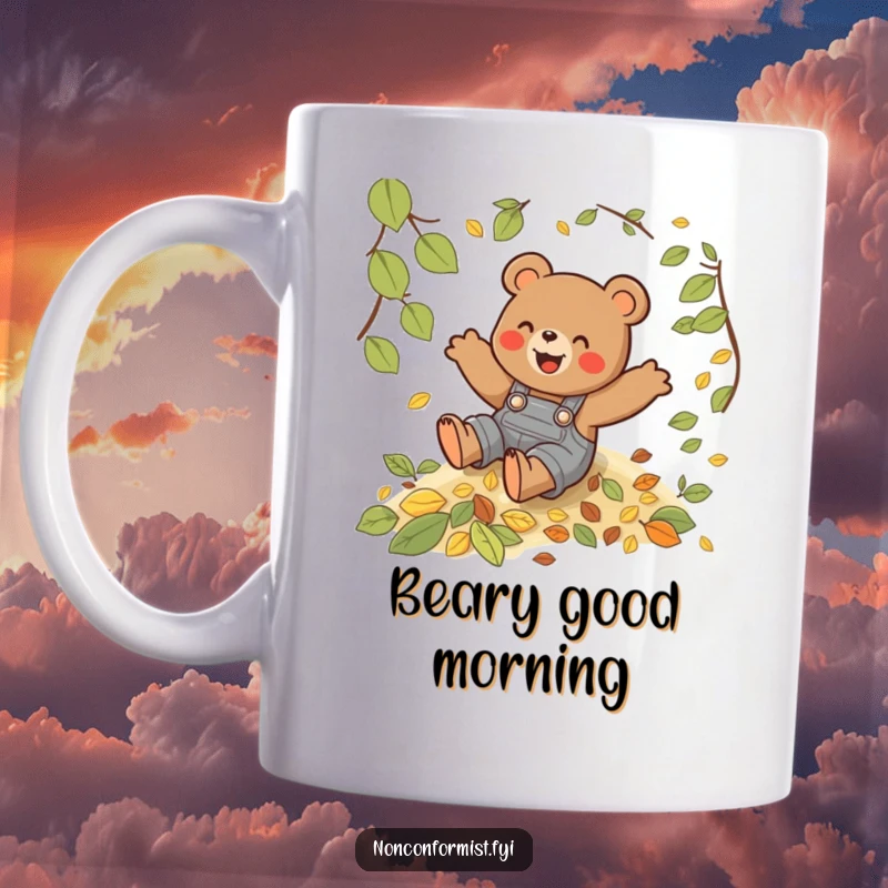 Funny mug featuring a playful bear in overalls gleefully sliding down a vibrant hill of autumn leaves.