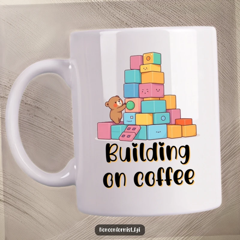 Funny Bear Mug featuring a small bear character building a lopsided tower of colorful, unusual blocks, showcasing playful creativity and charm.