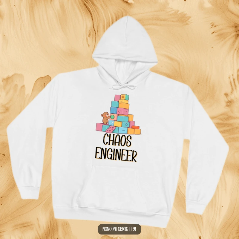 Funny Bear Hoodie featuring a small bear character building a lopsided tower of colorful, unusual blocks, providing a humorous and cozy layer.