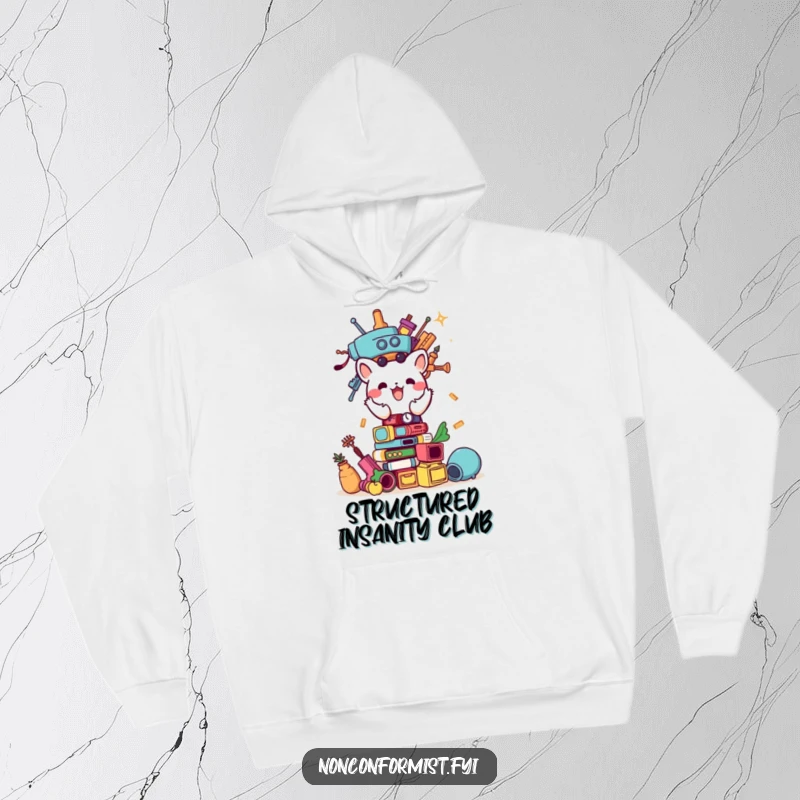Funny hoodie featuring a small animal character focused on building a comical tower of random objects, looking extremely pleased.