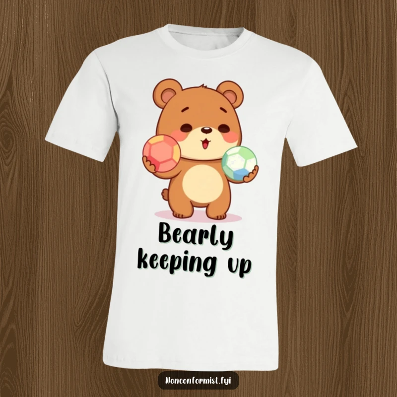 Funny cute bear t-shirt design showing a character wobbling while attempting to juggle three colorful balls with a determined look.