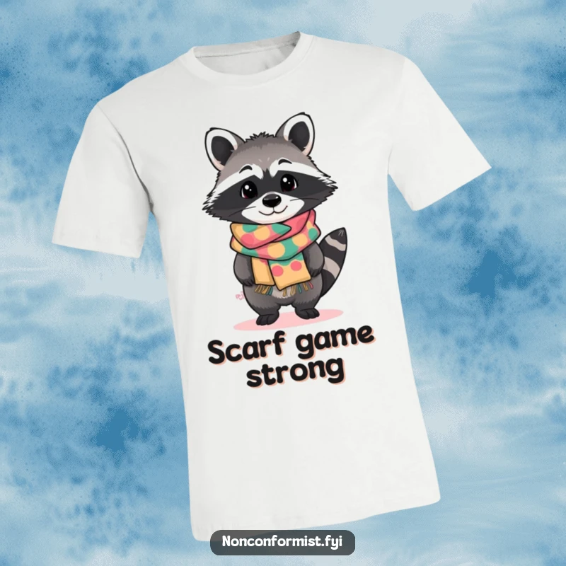 Funny t-shirt with a standout raccoon character tilting curiously, wearing a brightly patterned handmade scarf, showcasing quirky fashion.